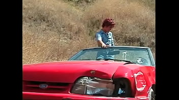 Redhead young floozie was fucked  in his red cabriolet-sedan